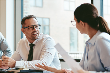 About Colleagues converse in an office room