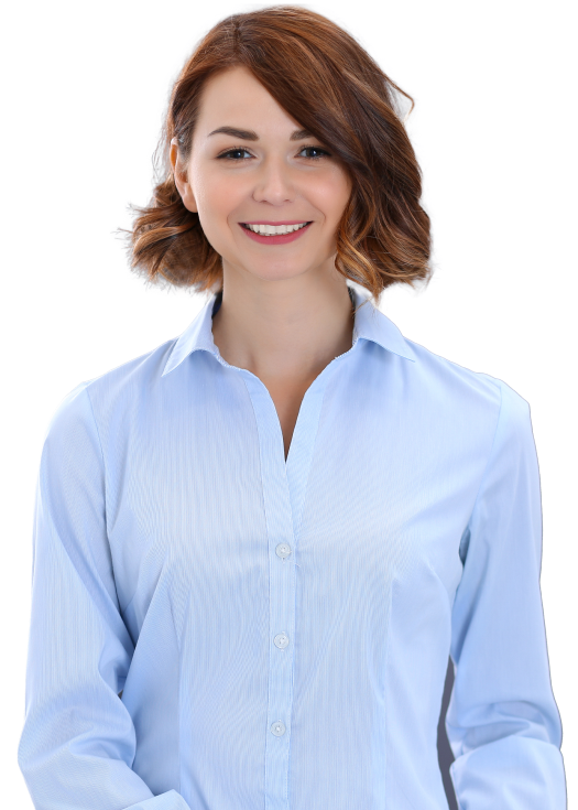 A professional smiles wearing a blue blouse