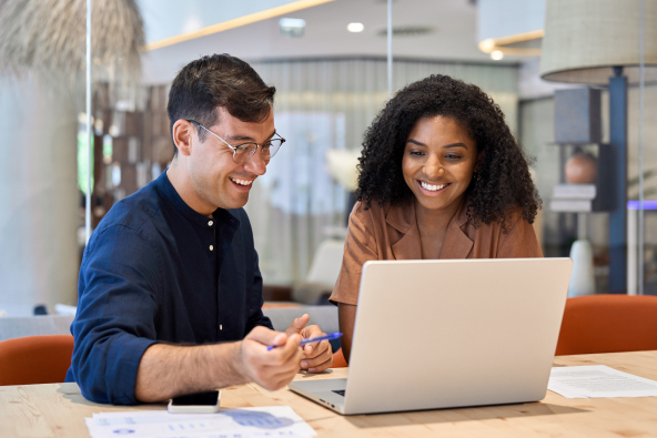 2 colleagues working at a laptop