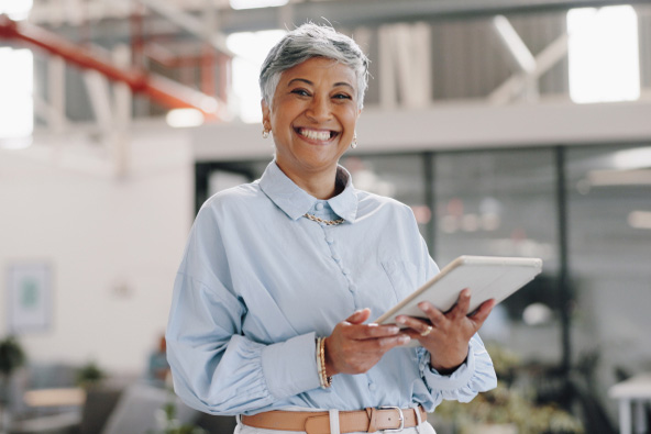 A businessperson holds a tablet