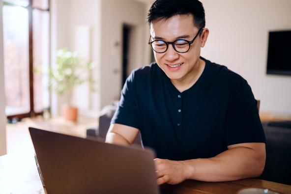 A male professional working on a laptop