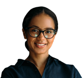 A person smiling and wearing glasses