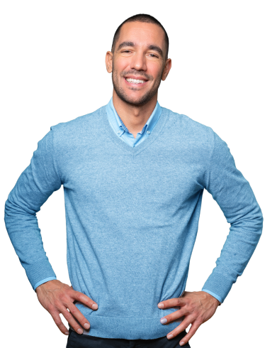 Coaching_for_Change-Hero A man in a blue sweater with hands on hips