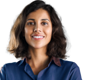 A person smiling against a grey background