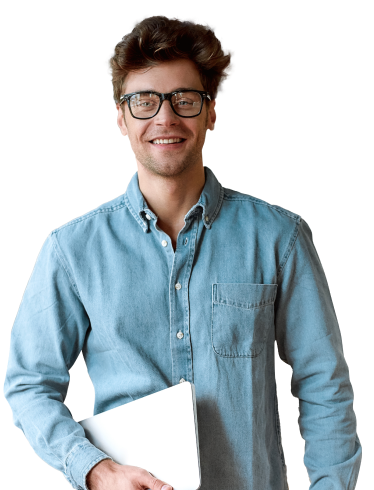 A young professional in a button-up denim shirt holding a tablet and smiling