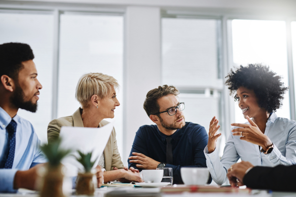 Colleagues meet at a conference table